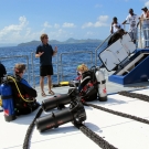 Dr. Andrew Bruckner explains scientific gear and processes to visiting school children.