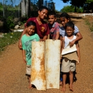 Tongan kids who created makeshift plastic "sleds."