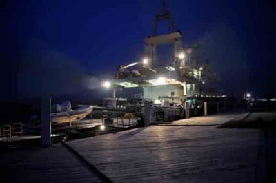 Golden Shadow in port at night