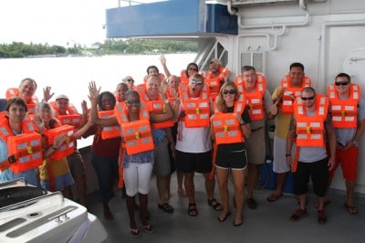 The research team shows off their life jackets during a safety drill