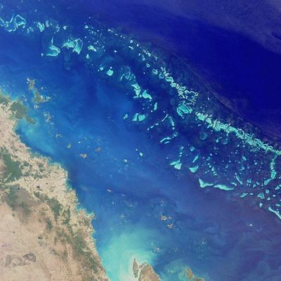 Satellite image of part of the Great Barrier Reef adjacent to the Queensland coastal areas of Airlie Beach and Mackay.
