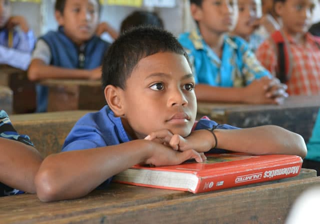 Education Research in Tonga: The students listened intently to the new information being provided during the coral reef seminar.