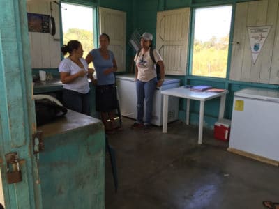 Inside the office fish buyers talk with marine scientist from Centre for Marine Studies (CEM)