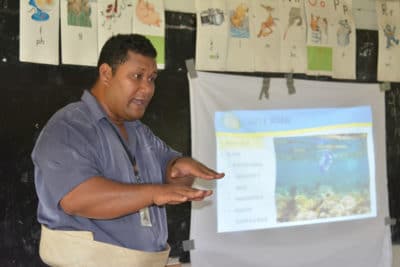 Apai Moala presenting Tongan coral reef education seminars at local schools