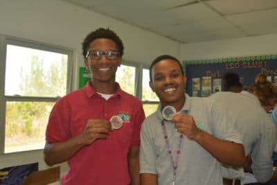 Students in the mangrove education and restoration program at Forest Heights Academy prepare their leaf samples and place them in agar plates.