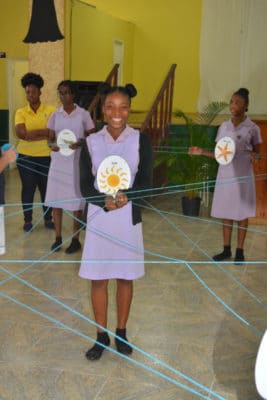 B.A.M. and J.A.M.I.N. – Students from St. Hilda High School form a food web as part of a J.A.M.I.N. activity.