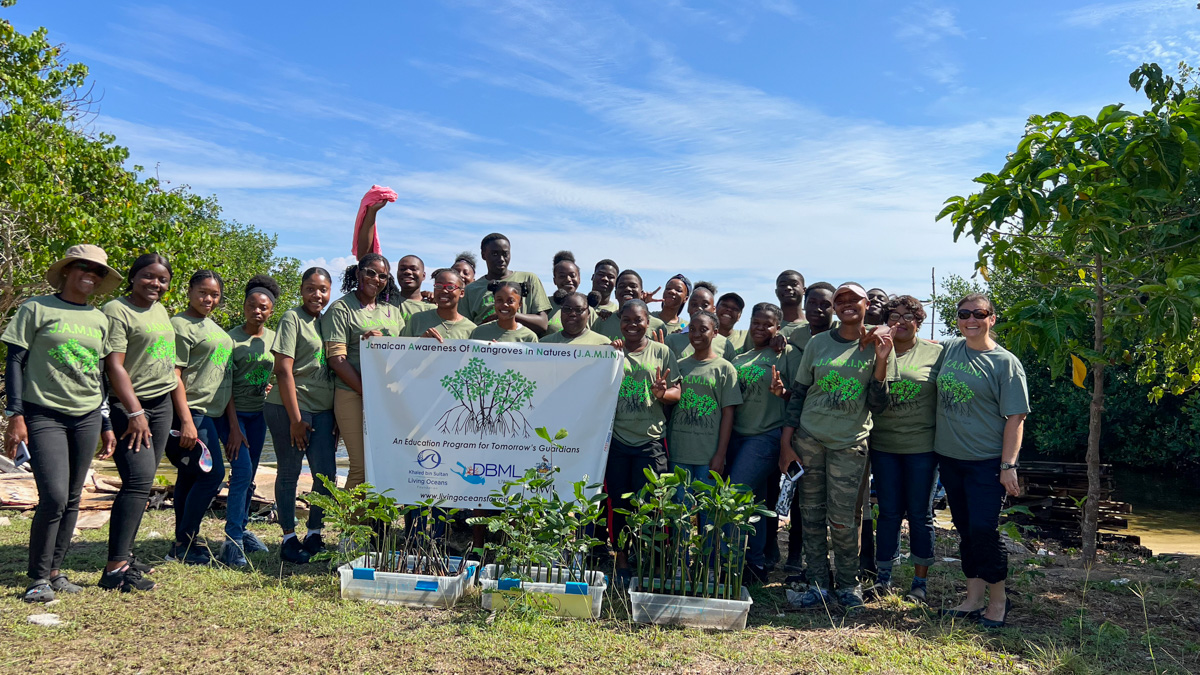 Photo: William Knibb Memorial High School students rejoice as they commemorate the successful culmination of their dedicated eight-month-long nurturing efforts by planting mangrove seedlings.