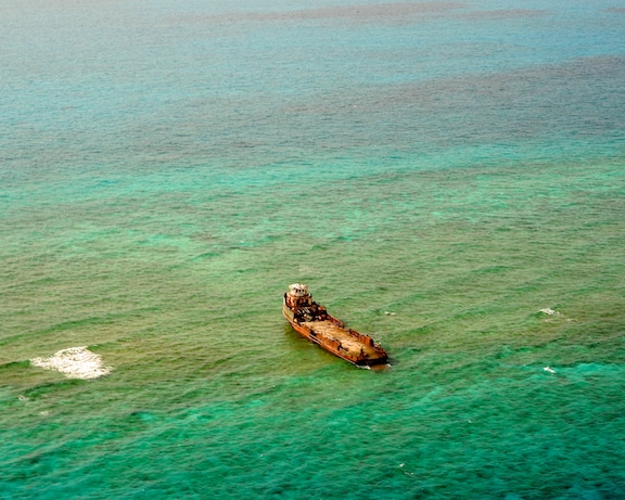 The inter-island freight ship, Lady Eagle, resting high and dry up on Hogsty Reef, Bahamas The inter-island freight ship, Lady Eagle, resting high and dry up on Hogsty Reef, Bahamas