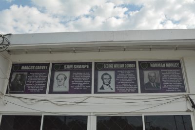 The portraits of the national heroes of Jamaica posted at the front of the school.