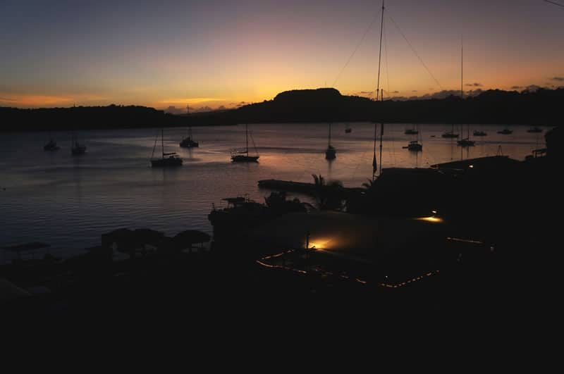 The sun rising over Port of Refuge Harbor, Vava’u, Tonga.