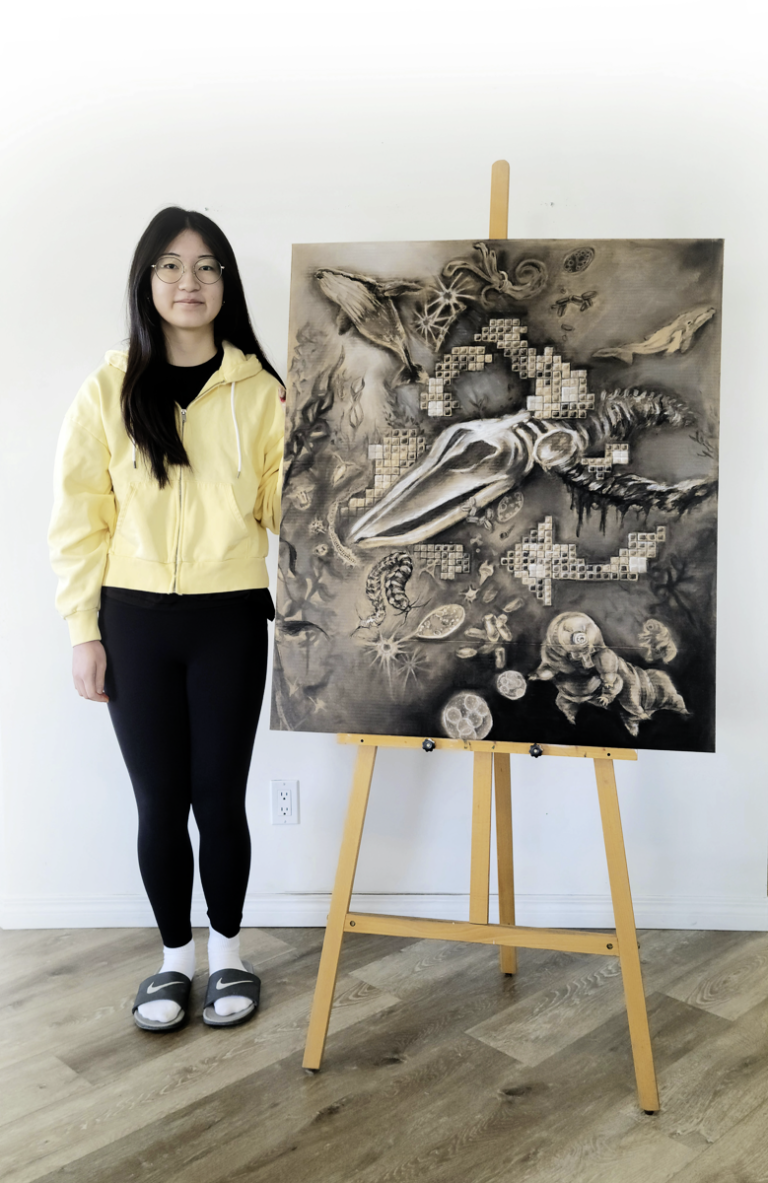 Olivia Shin with her winning artwork, "The Giant and the Invisible: A Story of Ocean Recycling”